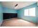 A bright bedroom with a chalkboard accent wall and a large window at 664 Mystic Cliffs Ave, Las Vegas, NV 89183