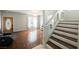 Inviting entryway with a staircase, wood floors, and a decorative front door at 664 Mystic Cliffs Ave, Las Vegas, NV 89183