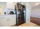 Bright kitchen with stainless steel appliances, white cabinets, and tiled floors at 664 Mystic Cliffs Ave, Las Vegas, NV 89183