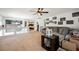 Spacious loft featuring a sectional sofa, ceiling fan, and ample natural light, perfect for relaxing at 664 Mystic Cliffs Ave, Las Vegas, NV 89183