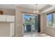 Cozy dining area with a sliding glass door to a covered patio at 6680 Caporetto Ln # 103, North Las Vegas, NV 89084