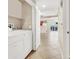 Laundry room with tile flooring and newer model washer and dryer at 6680 Caporetto Ln # 103, North Las Vegas, NV 89084