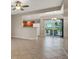 Open-concept living room with tile flooring and access to the patio at 6680 Caporetto Ln # 103, North Las Vegas, NV 89084