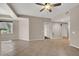 Spacious living room with tile floors, a ceiling fan, and neutral tones at 6680 Caporetto Ln # 103, North Las Vegas, NV 89084