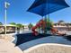 Community playground with colorful slides and play equipment, a safe and fun area for children to play at 6680 Caporetto Ln # 103, North Las Vegas, NV 89084