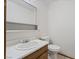 Cozy half-bathroom features a vanity with a white sink and a toilet at 7084 Burcot Ave # D27, Las Vegas, NV 89156