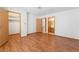 Spacious bedroom features wood floors and two doorways at 7084 Burcot Ave # D27, Las Vegas, NV 89156