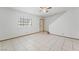 An open living room with tile flooring and natural lighting at 7084 Burcot Ave # D27, Las Vegas, NV 89156