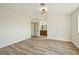Spacious bedroom with light wood floors and access to the bathroom at 744 Willow Ave, Henderson, NV 89002