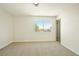Bright bedroom with neutral carpet, natural light from the window, and a view to the outside at 744 Willow Ave, Henderson, NV 89002