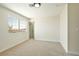 Bedroom features neutral carpet, natural light from the window, and a view to the outside at 744 Willow Ave, Henderson, NV 89002
