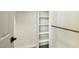 Closet with shelving and a wood hanging rod at 744 Willow Ave, Henderson, NV 89002