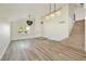 Open and spacious living room featuring modern lighting and staircase at 744 Willow Ave, Henderson, NV 89002