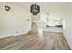 Bright living room featuring modern lighting, staircase and view to the kitchen at 744 Willow Ave, Henderson, NV 89002