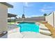 Refreshing in-ground pool with a tanning ledge and spa, complemented by desert landscaping at 744 Willow Ave, Henderson, NV 89002