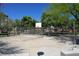 Outdoor community basketball court surrounded by lush green trees at 7653 Fabled Filigree St, Las Vegas, NV 89149