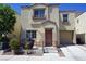 Inviting two-story home featuring a cute, fenced front porch and attached single-car garage at 7653 Fabled Filigree St, Las Vegas, NV 89149