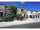 Charming townhome with a cozy front porch and well-maintained landscaping at 7653 Fabled Filigree St, Las Vegas, NV 89149