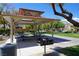 Charming community picnic area with shaded tables and barbecue grills for outdoor gatherings at 7653 Fabled Filigree St, Las Vegas, NV 89149