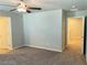 Spacious bedroom boasts soft carpet, neutral walls, a ceiling fan, and ample natural light at 7892 W Shelbourne Ave, Las Vegas, NV 89113