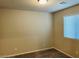 Bedroom offers neutral walls, carpeted floors, and a window for natural light, creating a serene space at 7892 W Shelbourne Ave, Las Vegas, NV 89113