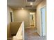 Upstairs hallway showcasing carpeted floors, neutral colored walls, and access to a bathroom at 7892 W Shelbourne Ave, Las Vegas, NV 89113