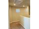 Hallway area upstairs features neutral paint, carpet flooring, and natural light from a window at 7892 W Shelbourne Ave, Las Vegas, NV 89113