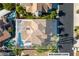Stunning aerial view of a beautiful home featuring a private pool and lovely landscaping at 8125 Sunset Cove Dr, Las Vegas, NV 89128