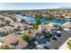Beautiful community aerial view featuring waterfront homes, lush greenery, and picturesque landscaping at 8125 Sunset Cove Dr, Las Vegas, NV 89128