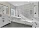 Modern bathroom featuring a standalone tub, shower, and dual sink vanity at 8125 Sunset Cove Dr, Las Vegas, NV 89128