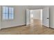 This bedroom is brightened by a large window and enhanced by natural-look wood flooring at 8125 Sunset Cove Dr, Las Vegas, NV 89128