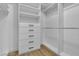Custom walk-in closet featuring shelves, drawers, and ample storage for clothing and accessories at 8125 Sunset Cove Dr, Las Vegas, NV 89128