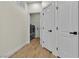 Hallway with modern doors leads to the laundry area with newer washer and dryer at 8125 Sunset Cove Dr, Las Vegas, NV 89128