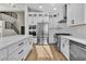 Bright kitchen with white cabinets, stainless steel appliances, and a modern design at 8125 Sunset Cove Dr, Las Vegas, NV 89128