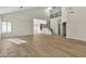 Open floor plan showcasing the staircase, soaring ceilings, and shuttered windows at 8125 Sunset Cove Dr, Las Vegas, NV 89128