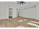Spacious primary bedroom features wood floors, vaulted ceilings, and en-suite bathroom entrance at 8125 Sunset Cove Dr, Las Vegas, NV 89128