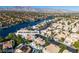 Picturesque waterfront scene displaying homes with beautiful water views and luscious palm trees at 8125 Sunset Cove Dr, Las Vegas, NV 89128