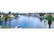 Scenic canal view, featuring houses with a peaceful waterfront and palm-tree-lined streets at 8125 Sunset Cove Dr, Las Vegas, NV 89128