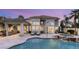 Stunning backyard oasis with a pool, spa, and outdoor kitchen perfect for entertaining guests at 8801 Rozetta Ct, Las Vegas, NV 89134