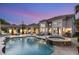 Backyard swimming pool with connected hot tub and covered outdoor seating with an outdoor kitchen at 8801 Rozetta Ct, Las Vegas, NV 89134