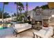 Wonderful backyard pool area with a stone fireplace and comfortable seating for outdoor enjoyment and relaxation at 8801 Rozetta Ct, Las Vegas, NV 89134