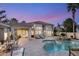 Backyard pool with a spa and an outdoor kitchen and plenty of seating for entertainment at 8801 Rozetta Ct, Las Vegas, NV 89134