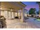 Stylish covered patio overlooking a sparkling pool and spa with manicured landscaping at 8801 Rozetta Ct, Las Vegas, NV 89134