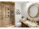 Bathroom with a walk-in shower and granite countertops at 8801 Rozetta Ct, Las Vegas, NV 89134