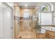 Bright bathroom featuring a glass shower and a soaking tub with natural light at 8801 Rozetta Ct, Las Vegas, NV 89134