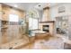 Lavish bathroom with a tiled shower, tub, fireplace, and natural light at 8801 Rozetta Ct, Las Vegas, NV 89134