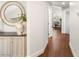 Hallway featuring hardwood floors and a decorative mirror at 8801 Rozetta Ct, Las Vegas, NV 89134