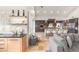 Gourmet kitchen view into the living area featuring a breakfast bar and floating shelves for storage at 8801 Rozetta Ct, Las Vegas, NV 89134
