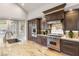A well-lit kitchen with modern appliances, including a stainless steel range and backsplash at 8801 Rozetta Ct, Las Vegas, NV 89134