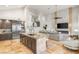 An open-concept kitchen and living room area with high ceilings and fireplace at 8801 Rozetta Ct, Las Vegas, NV 89134